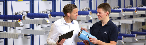 People in front of a SAHM winding machine - model SAHM 460XE Series